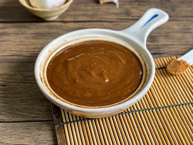 Homemade hoisin sauce served in a small ceramic bowl.