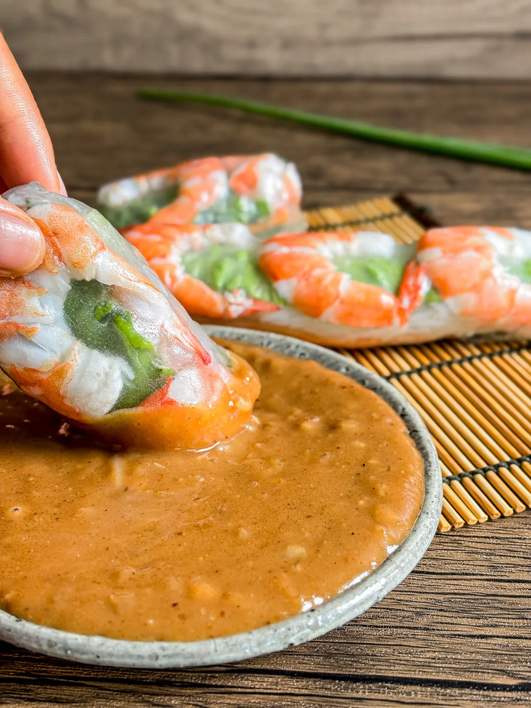 Peanut hoisin sauce with a Vietnamese fresh spring roll dipped into the thick, creamy sauce.