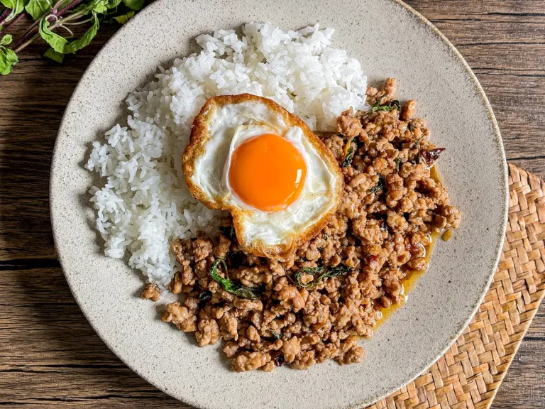 Thai holy basil stir-fry with ground pork, rice, and a crispy fried egg.