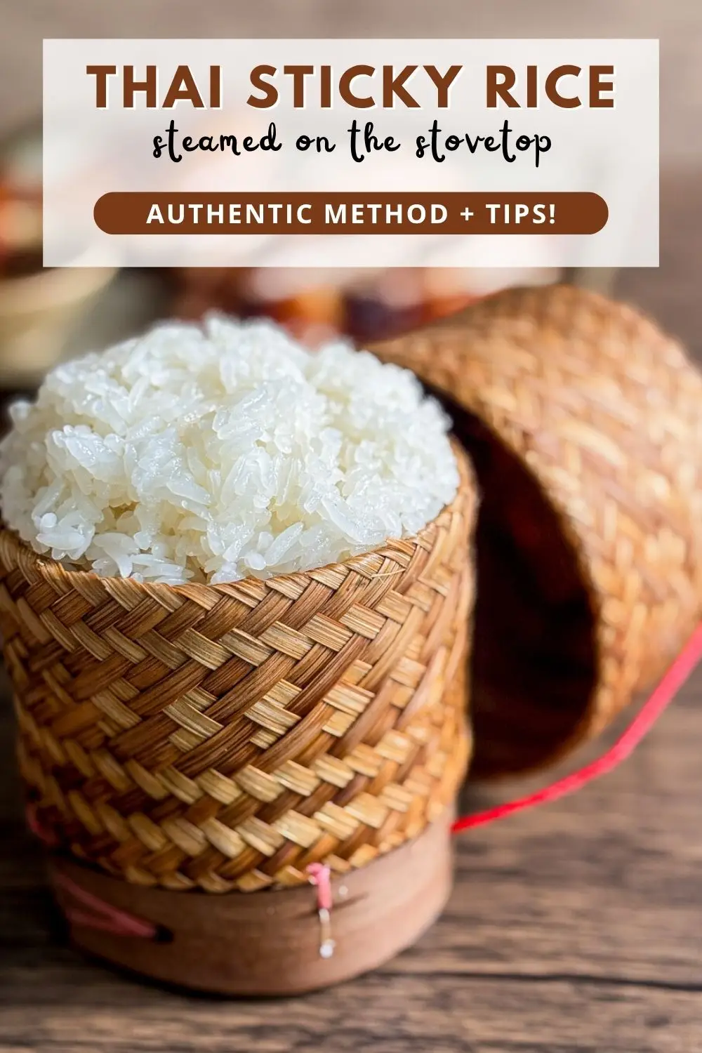 Steamed Thai sticky rice served in a traditional bamboo basket on a wooden table.