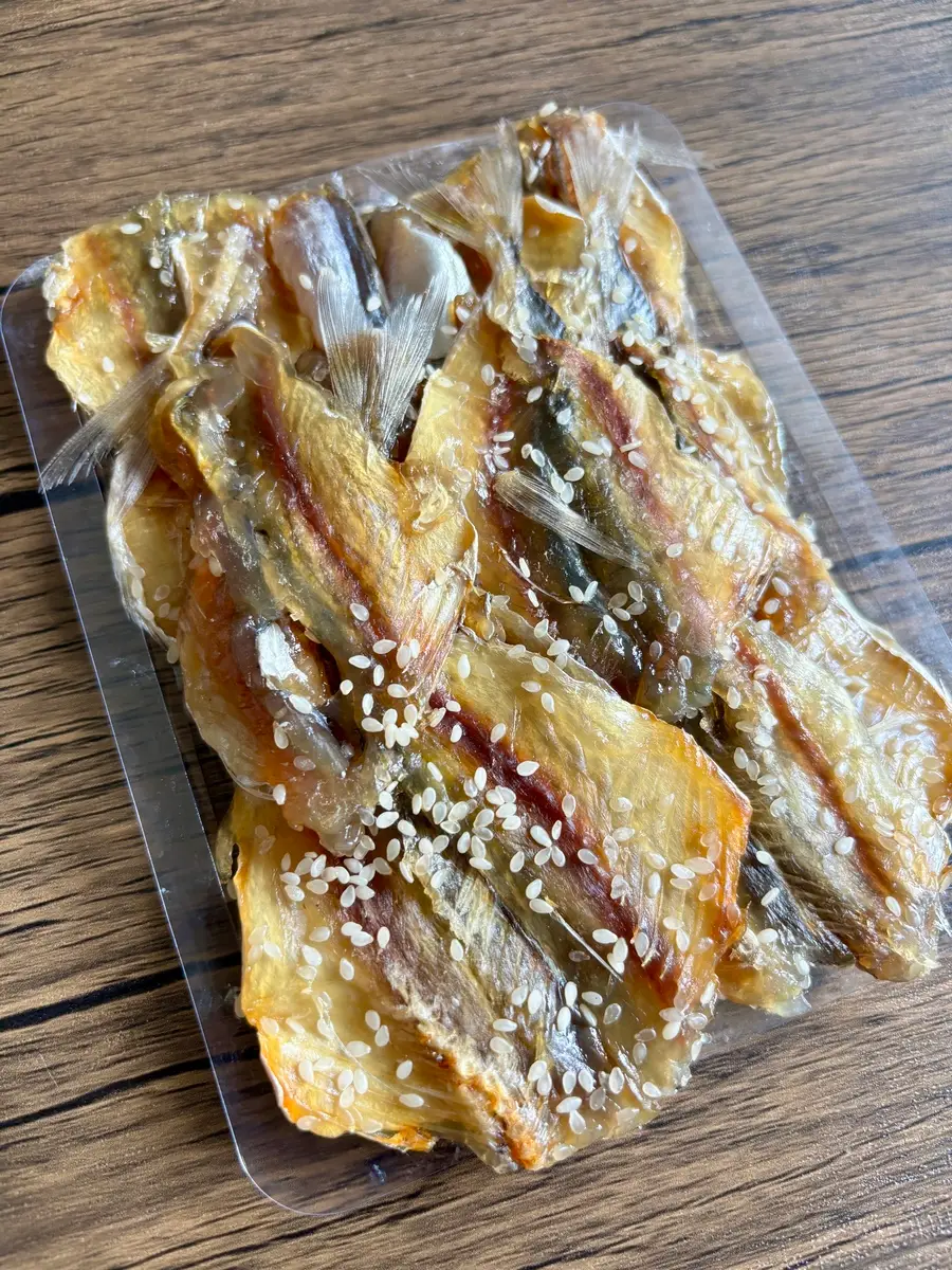 Pack of dried fish with sesame seeds.