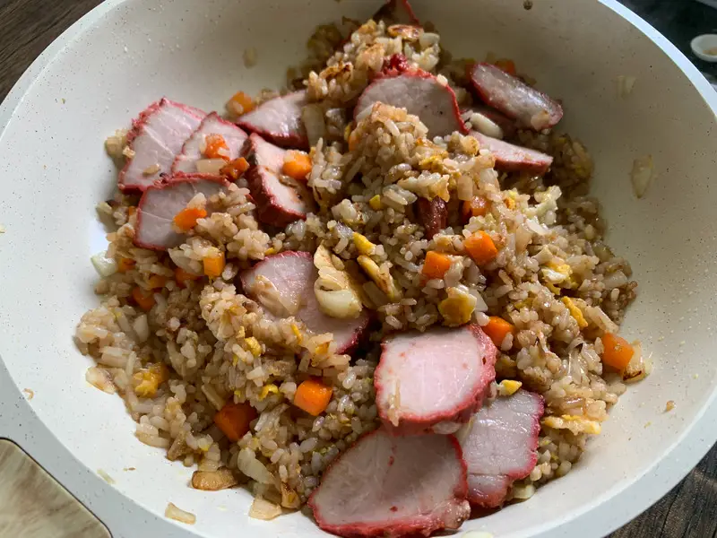 Sliced char siu pork added to the finished fried rice.